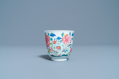 A Chinese famille rose cup and saucer with a bird on a blossoming branch, Yongzheng