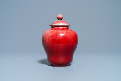 A Chinese monochrome copper red vase and cover, Qianlong/Jiaqing