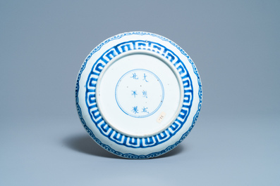 A Chinese blue and white 'phoenix' dish, a 'crab' bowl and a lotus-shaped bowl, Kangxi