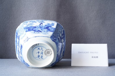 A Chinese blue and white bowl with a lady with cat, Kangxi mark and of the period