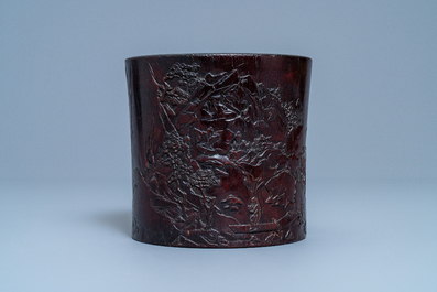 A Chinese carved zitan wood brush pot with a mountainous landscape, 17/18th C.