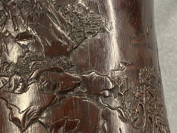 A Chinese carved zitan wood brush pot with a mountainous landscape, 17/18th C.