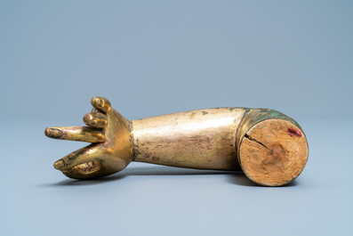 A Tibetan gilt bronze and copper alloy arm of Buddha, Ming