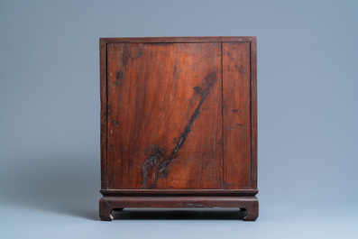 A Chinese mother-of-pearl-inlaid wooden two-door cabinet, 19th C.