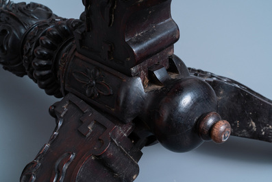 A Chinese carved wooden table with a large Canton famille verte plaque, 19th C.