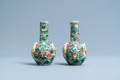 A pair of Chinese reticulated famille verte bottle vases, 19th C.