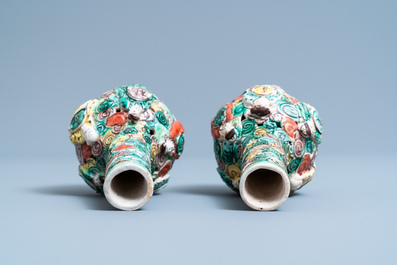 A pair of Chinese reticulated famille verte bottle vases, 19th C.