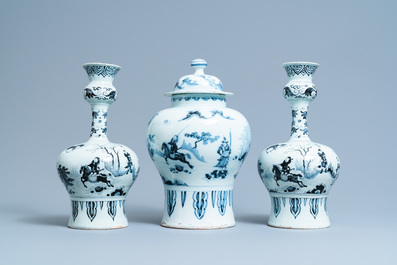 A Dutch Delft blue and white chinoiserie garniture of three vases, 17/18th C.