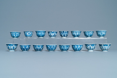 A large collection of Chinese blue and white cups and saucers, Kangxi/Qianlong