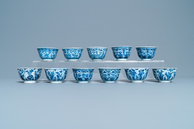 A large collection of Chinese blue and white cups and saucers, Kangxi/Qianlong