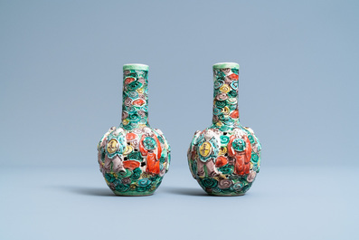 A pair of Chinese reticulated famille verte bottle vases, 19th C.