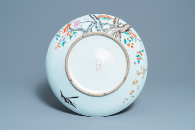 A large Chinese famille rose 'prunus and magpie' dish, Qianlong mark, 19th C.