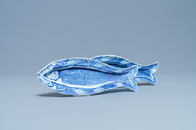 A pair of Dutch Delft blue and white 'herring' dishes, 18th C.