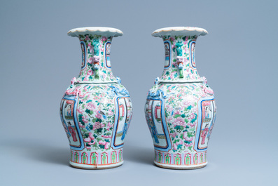 A pair of Chinese famille rose 'court scene' vases, 19th C.