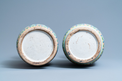 A pair of Chinese famille rose celadon-ground 'dragon' vases, 19th C.