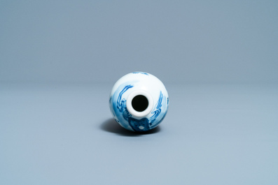 A small Chinese blue, white and copper-red vase, 19th C.