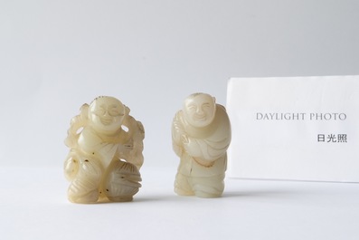 Two Chinese celadon jade figures of boys, 19/20th C.