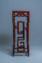 A tall Chinese marble-inlaid wooden stand, 20th C.