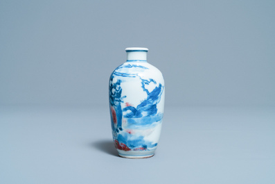 A small Chinese blue, white and copper-red vase, 19th C.