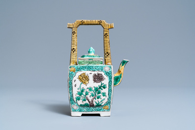 A Chinese verte biscuit teapot and cover, Kangxi