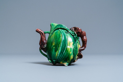 A Chinese verte biscuit peach-shaped 'cadogan' teapot, Kangxi