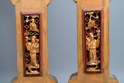 A Chinese gilded wood carving on matching pillars, 19th C.