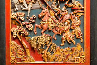 A Chinese lacquered and polychromed carved wooden panel, 19th C.