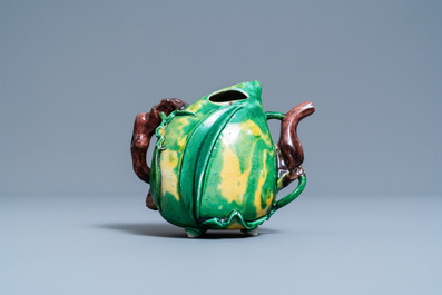 A Chinese verte biscuit peach-shaped 'cadogan' teapot, Kangxi