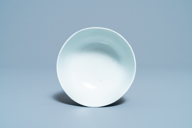 A Chinese white slip-decorated blue-ground 'dragon' bowl, Yu Tang Jia Qi mark, Wanli