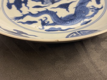 A Chinese blue and white 'dragon and Shou' dish, Yongzheng mark and of the period