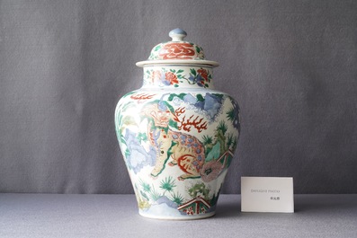 A Chinese wucai 'mythical beasts' vase and cover, Transitional period