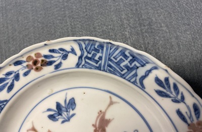 A Chinese blue, white and copper red 'fish' plate, Chenghua mark, Kangxi