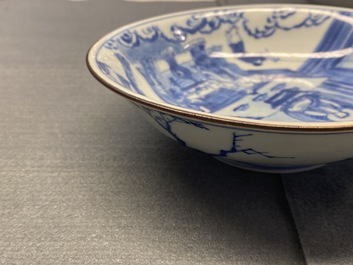 A fine Chinese blue and white Xi Xiang Ji 'temple scene' shallow bowl, Jiajing mark, Kangxi