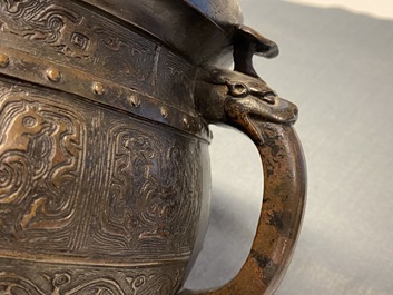 A large Chinese bronze 'Gui' vessel on hardwood stand, Yuan