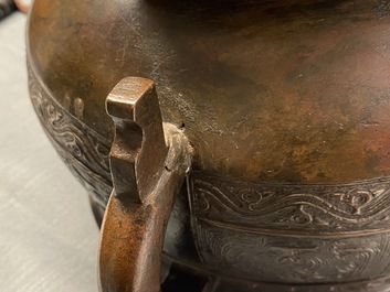 A large Chinese bronze 'Gui' vessel on hardwood stand, Yuan