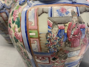 A pair of Chinese famille rose 'court scene' vases, 19th C.