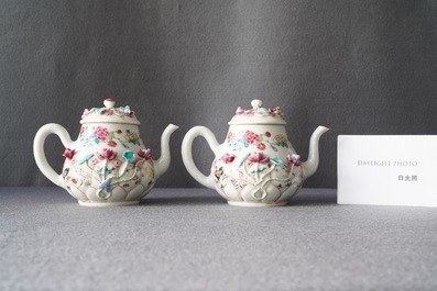 A pair of Chinese famille rose relief-decorated teapots and covers, Yongzheng