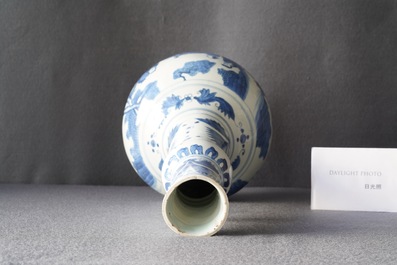 A Chinese blue and white bottle vase with figures in a landscape, Transitional period