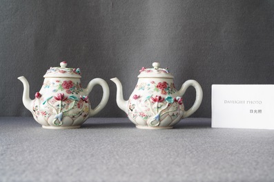 A pair of Chinese famille rose relief-decorated teapots and covers, Yongzheng