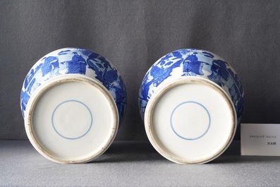 A pair of Chinese blue and white vases and covers with figures in a landscape, 19th C.