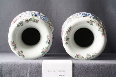 A pair of Chinese famille rose 'court scene' vases, 19th C.