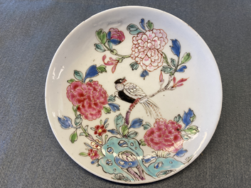 A Chinese famille rose cup and saucer with a bird on a blossoming branch, Yongzheng