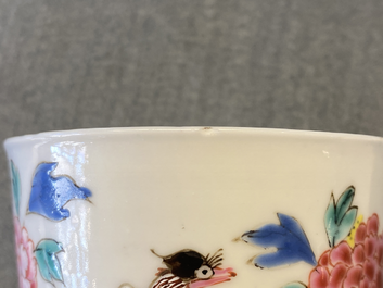 A Chinese famille rose cup and saucer with a bird on a blossoming branch, Yongzheng