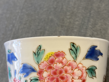 A Chinese famille rose cup and saucer with a bird on a blossoming branch, Yongzheng