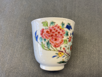 A Chinese famille rose cup and saucer with a bird on a blossoming branch, Yongzheng