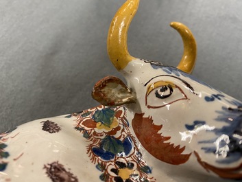 A pair of of polychrome Dutch Delft models of cows, 18th C.