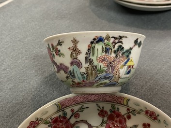 A pair of Chinese famille rose cups and saucers with landscape design, Yongzheng