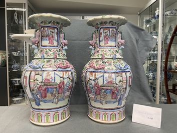 A pair of Chinese famille rose 'court scene' vases, 19th C.