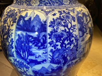 A massive Chinese blue and white vase with floral and landscape panels, Kangxi