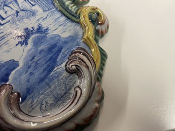 A pair of polychrome Dutch Delft plaques with countryside scenes, 19th C.
